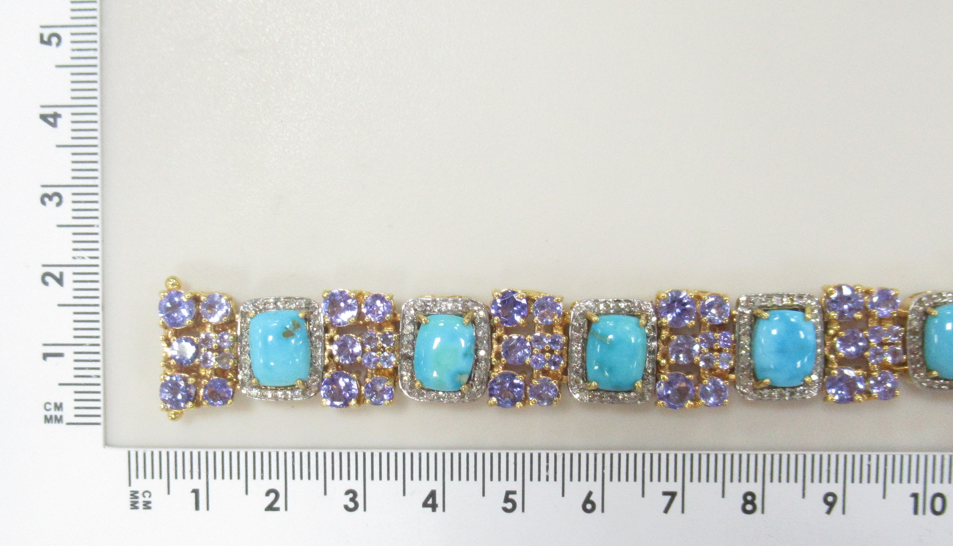 Серебряный браслет 925 пробы; родий; вставки 10 Бирюза 16,0ct; 283 Бр.Кр-17 1,5 3/4ct; 90 Танзанит 14,7ct